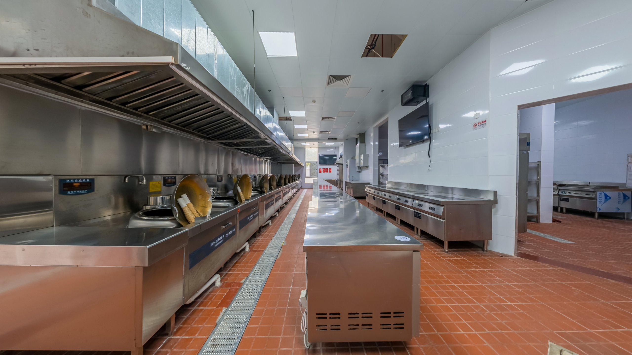 Spacious commercial kitchen interior with durable safety flooring