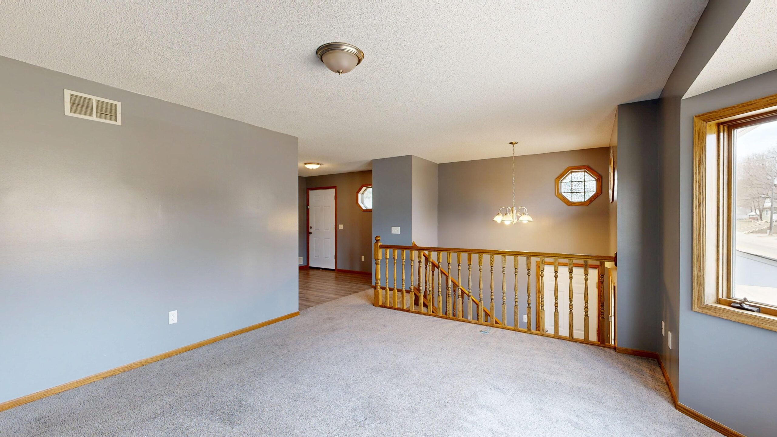Commercial corridor with grey carpet flooring