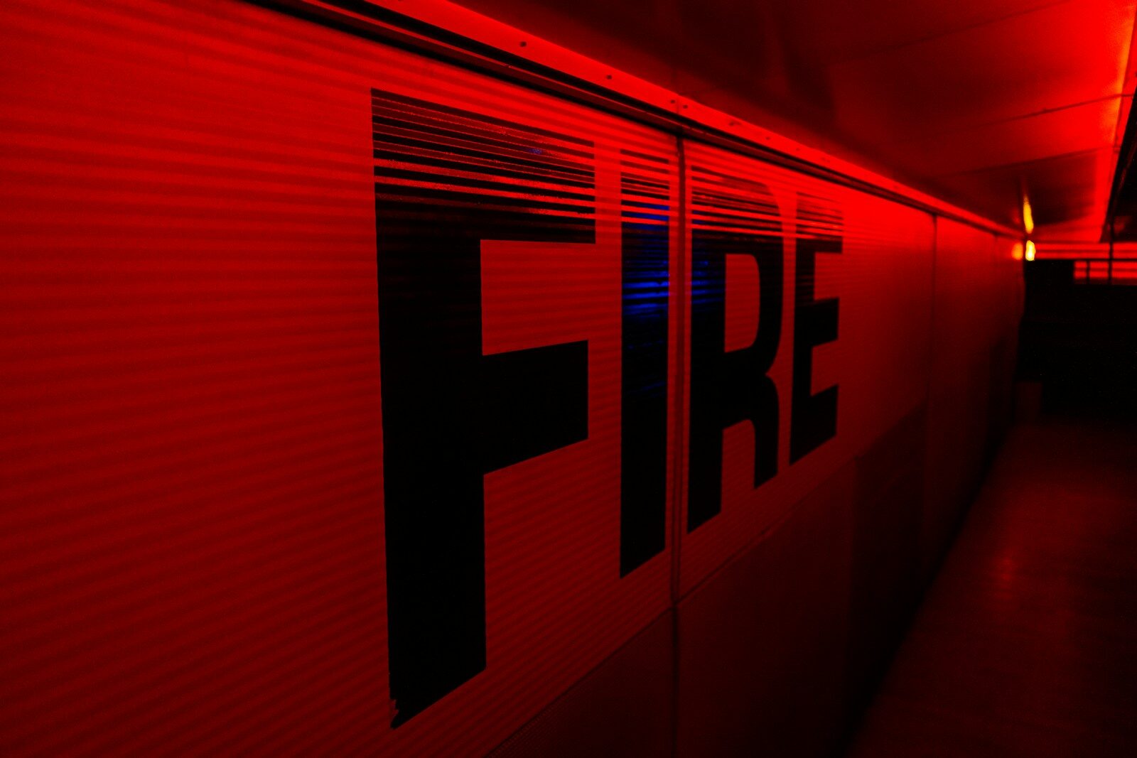 a red wall with the word fire painted on it